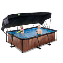 Carregar imatge al visor de la galeria, Piscina EXIT Wood 220x150x65 amb bomba de filtre i tendal - marró